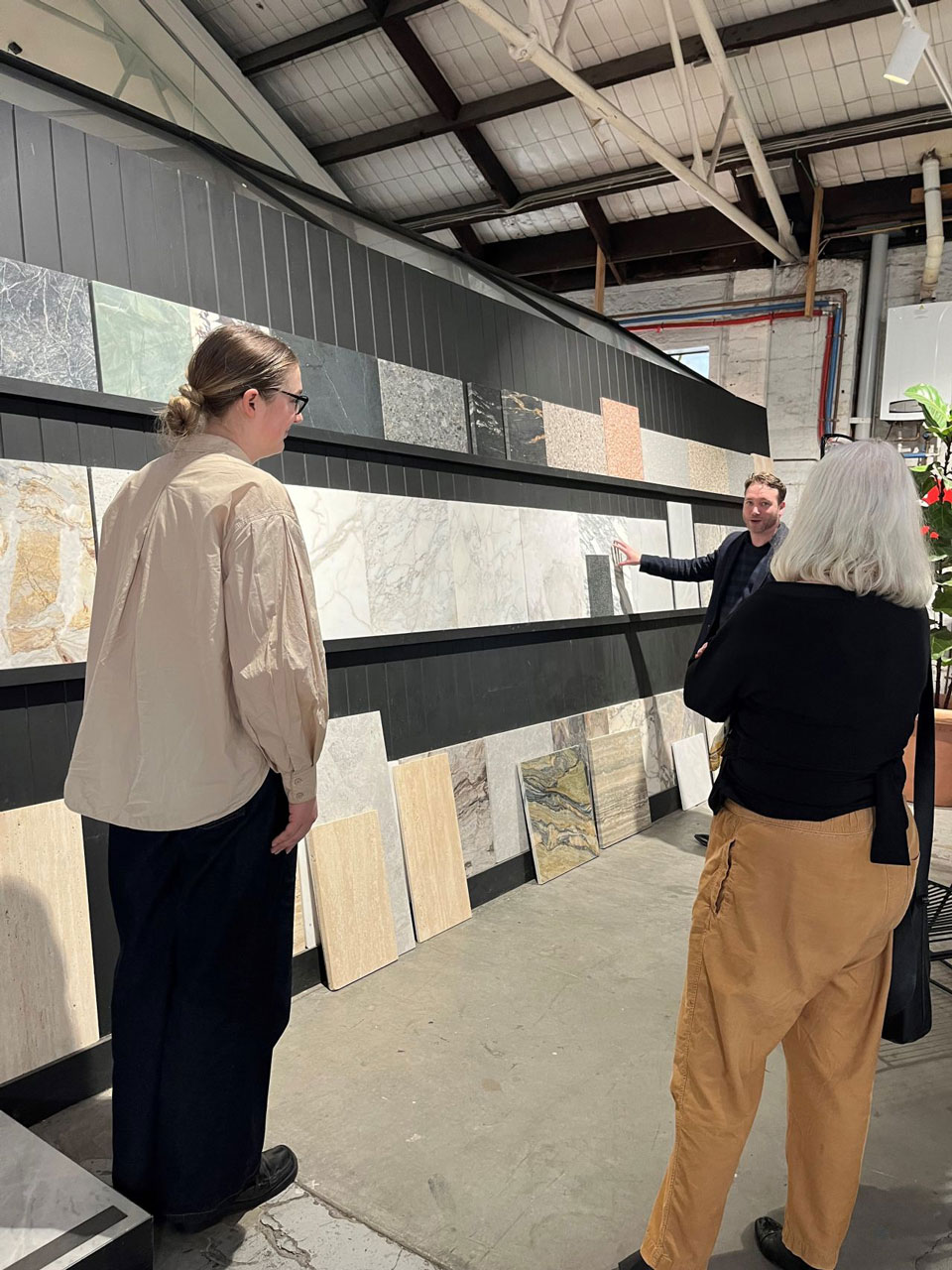 Material selection — natural stone for residential interiors Mike & Morlly Architects selecting natural stone slabs at a Sydney stoneyard for a residential interior project