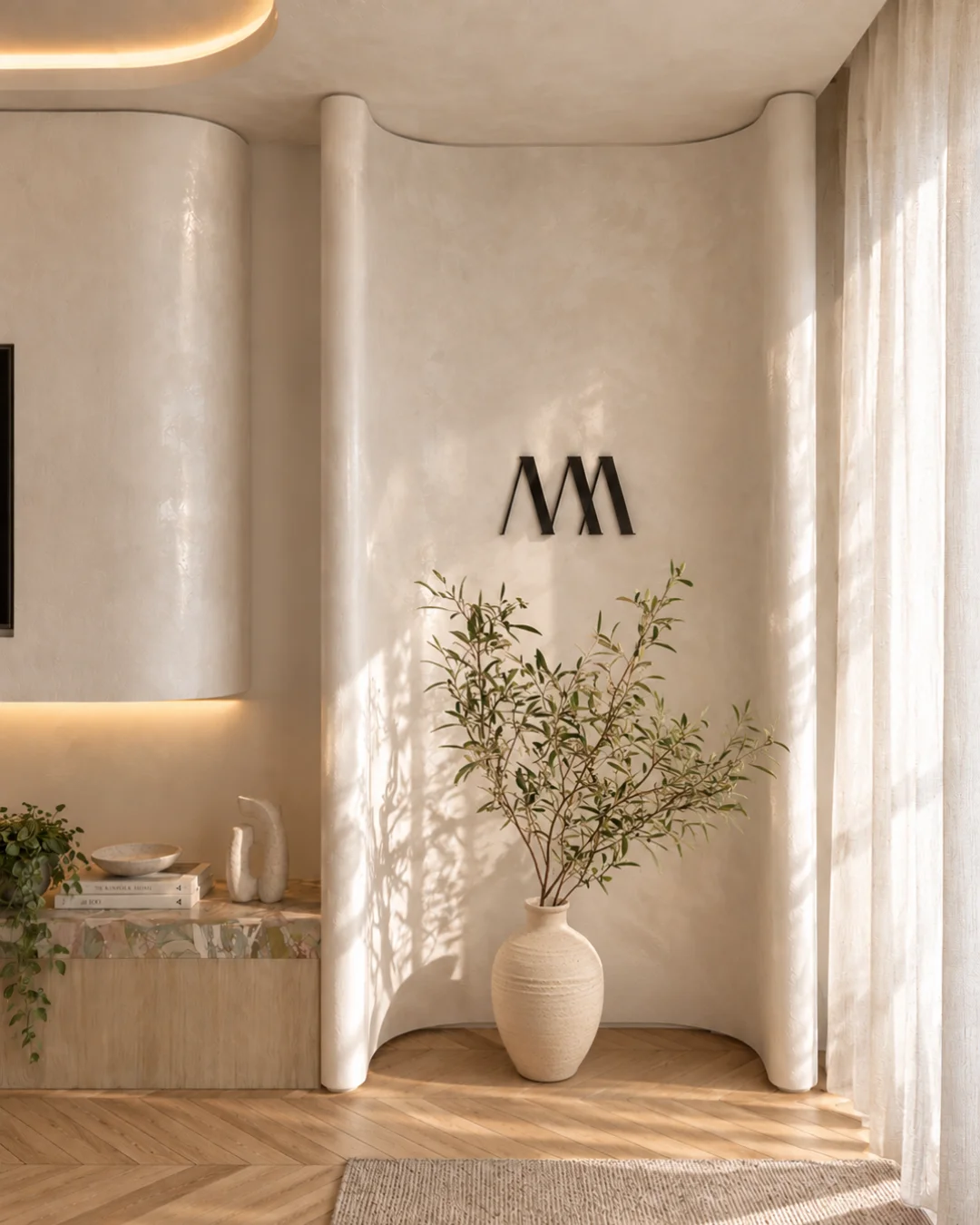 Proposed Watsons Bay studio interior with curved wall, MMA logo and vase — play the studio film