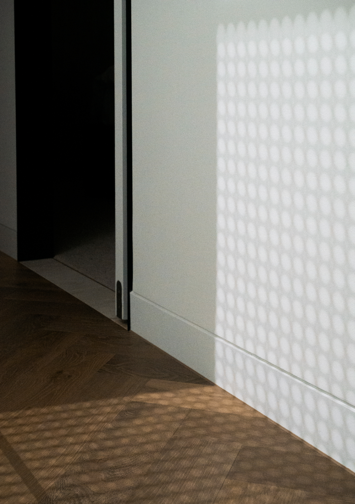 58 Clara Street South Yarra by Mike and Morlly Architects — shadow play across textured wall 58 Clara Street South Yarra by Mike and Morlly Architects — shadow play across textured wall