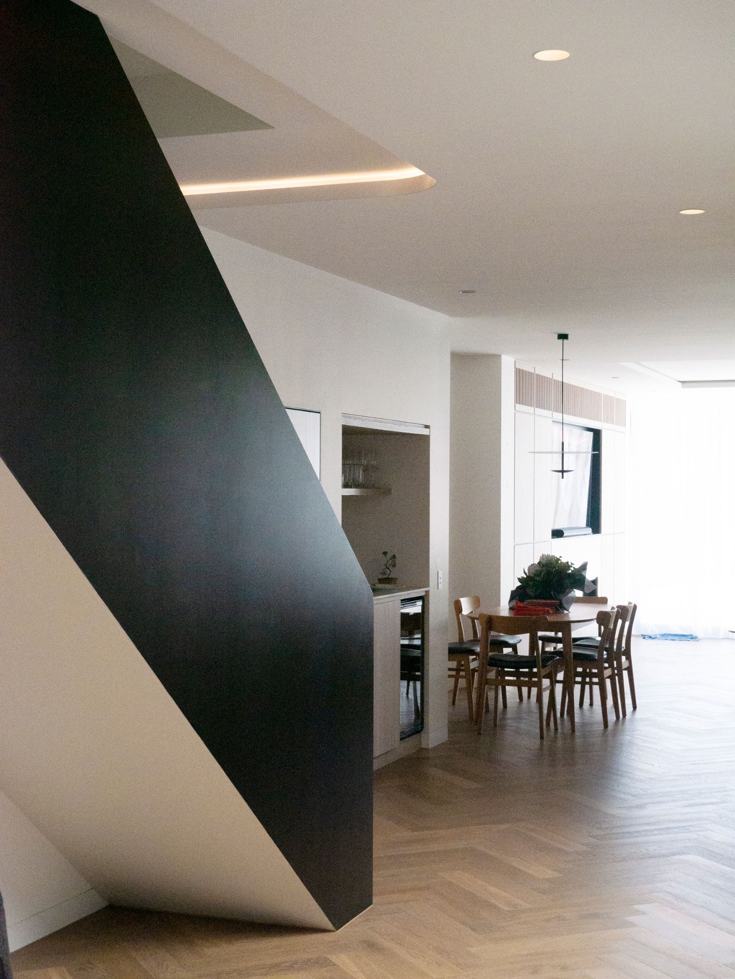 58 Clara Street South Yarra by Mike and Morlly Architects — dining area beside sculptural staircase 58 Clara Street South Yarra by Mike and Morlly Architects — dining area beside sculptural staircase